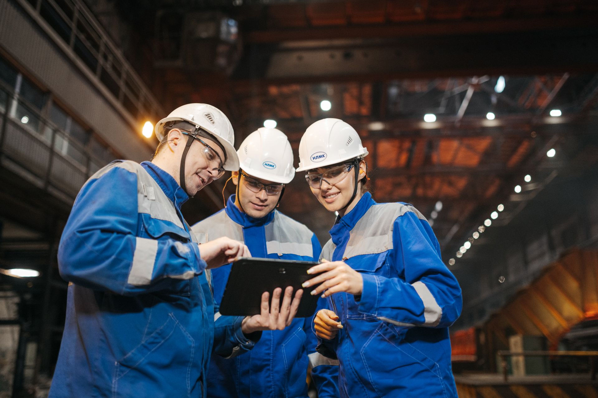 Engineers reviewing a project on-site inside an industrial facility